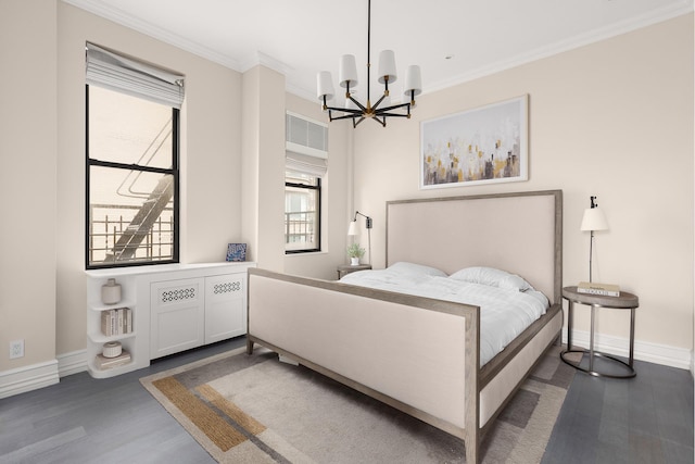 bedroom featuring wood finished floors, a chandelier, baseboards, and ornamental molding