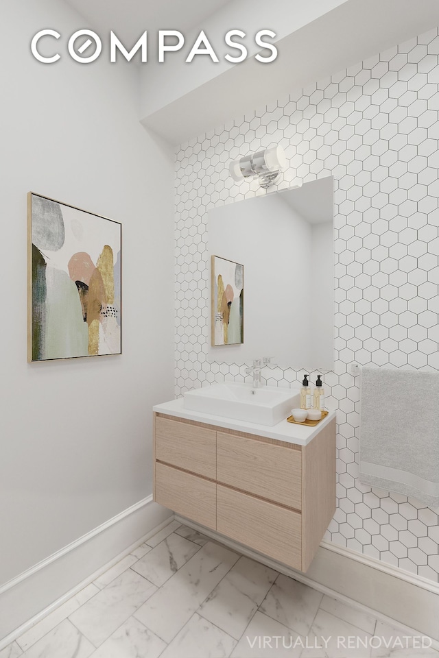 bathroom with vanity and marble finish floor