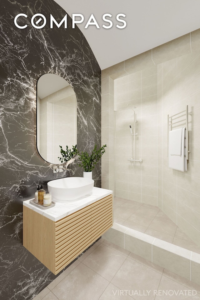 full bath with a walk in shower, tile patterned flooring, and vanity