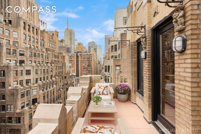 balcony featuring a view of city