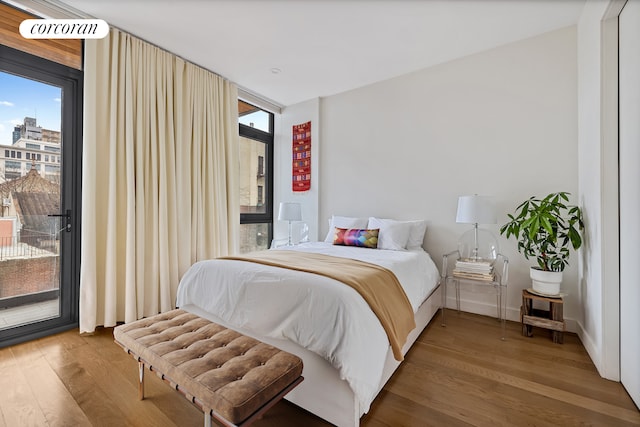 508 Waverly Ave Unit 4, New York City, NY 11238 - bedroom featuring wood finished floors and access to exterior