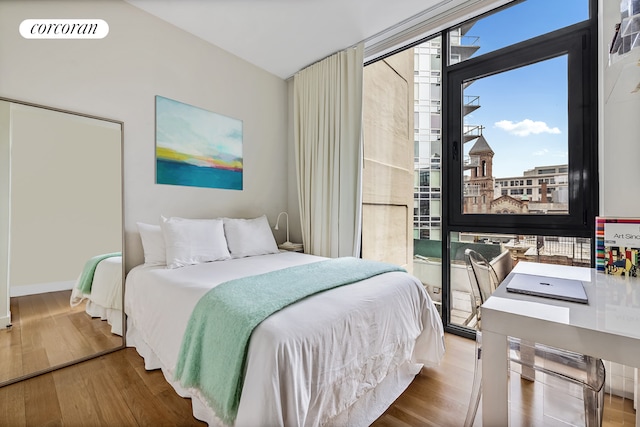508 Waverly Ave Unit 4, New York City, NY 11238 - bedroom featuring wood finished floors, floor to ceiling windows, and baseboards
