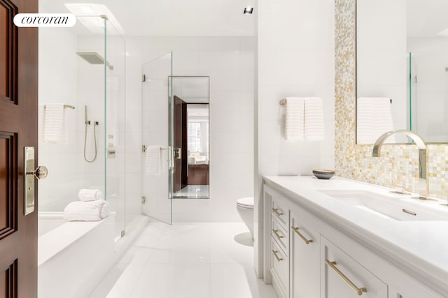 46 E 66th St, New York City, NY 10065 - full bathroom with vanity, toilet, a shower stall, tile patterned flooring, and tile walls