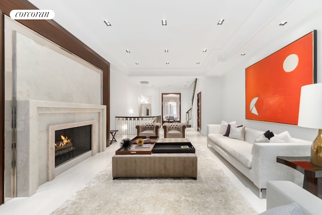 46 E 66th St, New York City, NY 10065 - living room with a tray ceiling, a premium fireplace, and recessed lighting