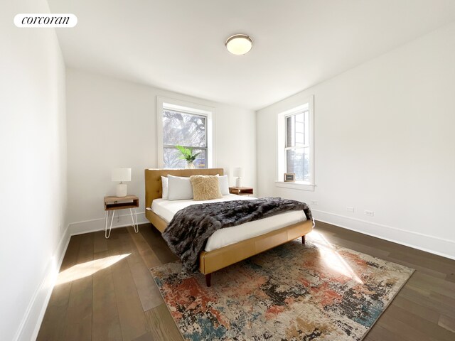 148-09 Northern Blvd Unit 1J, New York City, NY 11354 - bedroom featuring dark wood-type flooring and baseboards