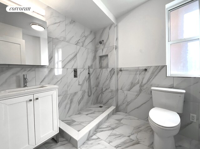148-09 Northern Blvd Unit 1J, New York City, NY 11354 - full bathroom with tile walls, vanity, a tile shower, marble finish floors, and toilet