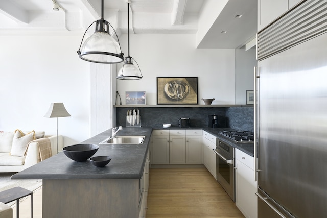 30 Main St Unit 7H, New York City, NY 11201 - kitchen with appliances with stainless steel finishes, a sink, dark countertops, and tasteful backsplash