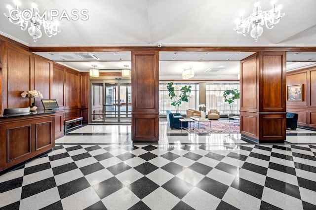 common area with a decorative wall and ornamental molding