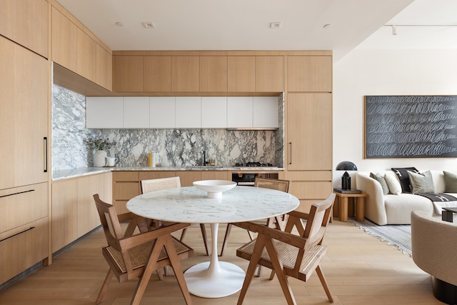 517 W 29th St Unit 8H, New York City, NY 10001 - dining room featuring light wood finished floors
