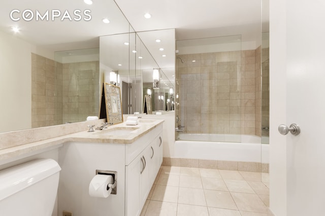 full bath featuring tile patterned flooring, vanity, toilet, recessed lighting, and tub / shower combination