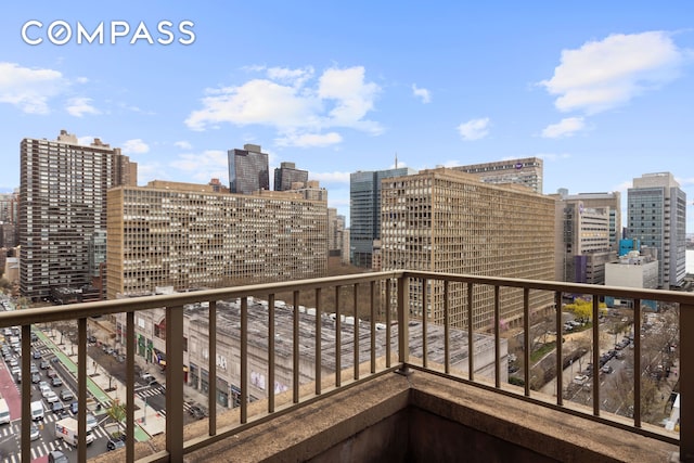 balcony featuring a view of city
