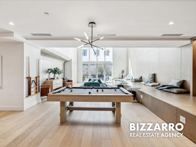 208 Delancey St Unit 8F, New York City, NY 10002 - rec room with light wood-style floors, pool table, and a chandelier