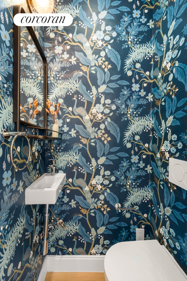 64 2nd St, New York City, NY 11231 - half bathroom with wood finished floors and toilet