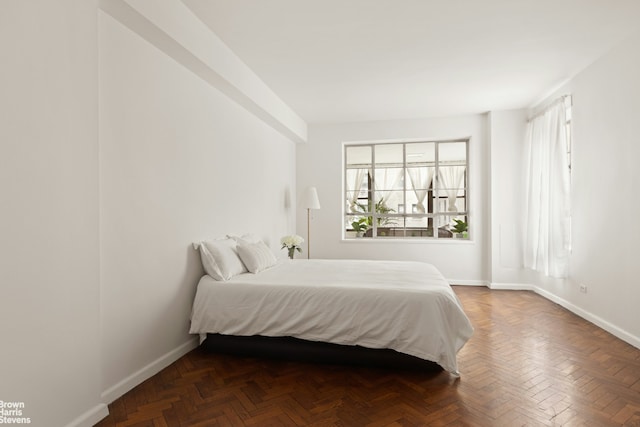 bedroom featuring baseboards