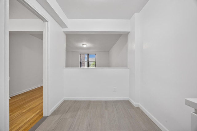 302 96th St Unit 2-W, New York City, NY 11209 - unfurnished room with baseboards and wood finished floors