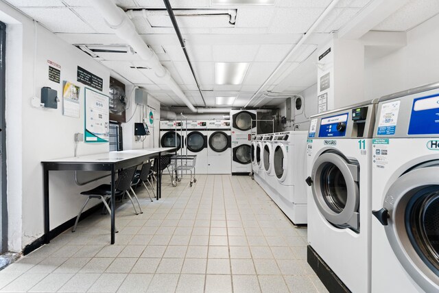 302 96th St Unit 2-W, New York City, NY 11209 - communal laundry room with stacked washer / dryer and washing machine and dryer