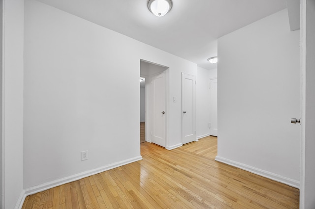 302 96th St Unit 2-W, New York City, NY 11209 - spare room with hardwood / wood-style flooring and baseboards