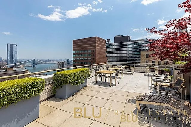 99 John St Unit Ph-9, New York City, NY 10038 - view of patio featuring a view of city and a water view