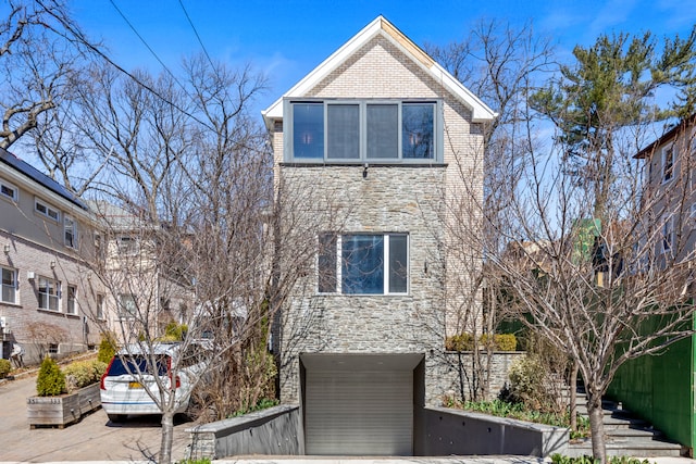333 W 262nd St, New York City, NY 10471 - view of front of home featuring stone siding and brick siding