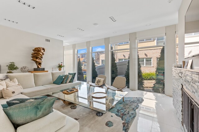 333 W 262nd St, New York City, NY 10471 - living room with a stone fireplace and visible vents