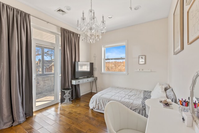 333 W 262nd St, New York City, NY 10471 - bedroom featuring visible vents, multiple windows, a chandelier, and hardwood / wood-style flooring