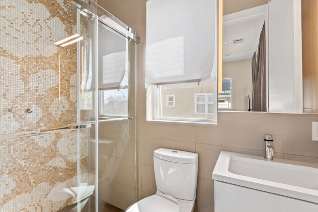 333 W 262nd St, New York City, NY 10471 - full bathroom with toilet, tile walls, a shower stall, and a wealth of natural light