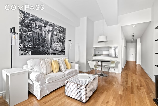 99 John St Unit 522, New York City, NY 10038 - living area featuring light wood-type flooring and baseboards