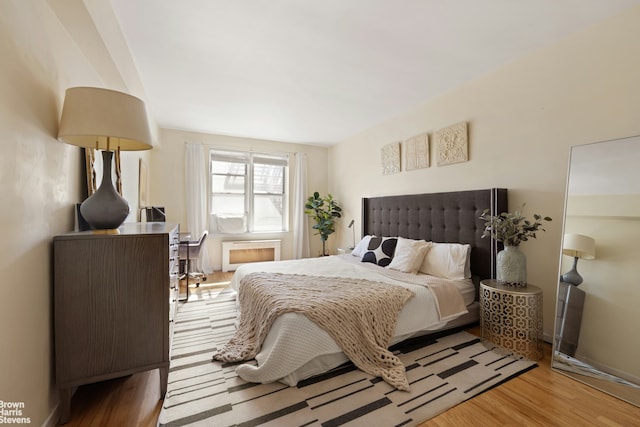bedroom with wood finished floors