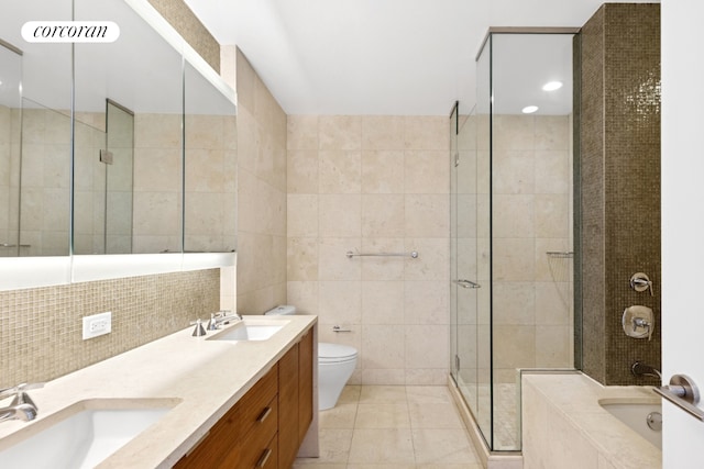 bathroom with tile walls, tile patterned flooring, a stall shower, toilet, and a bath