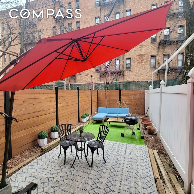 330 E 94th St Unit 1Ab, New York City, NY 10128 - fenced backyard with grilling area and a patio area