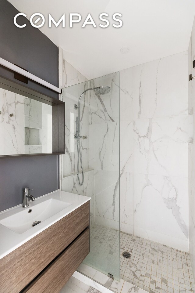 330 E 94th St Unit 1Ab, New York City, NY 10128 - bathroom featuring vanity and a marble finish shower