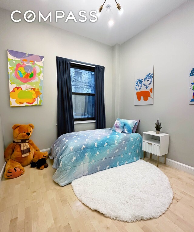 330 E 94th St Unit 1Ab, New York City, NY 10128 - bedroom with wood finished floors and baseboards