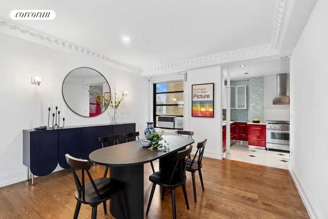 215 W 91st St Unit 111, New York City, NY 10025 - dining space with wood finished floors, baseboards, cooling unit, crown molding, and recessed lighting