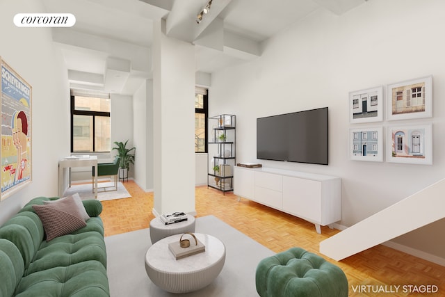 310 E 46th St Unit 9C, New York City, NY 10017 - living room featuring baseboards