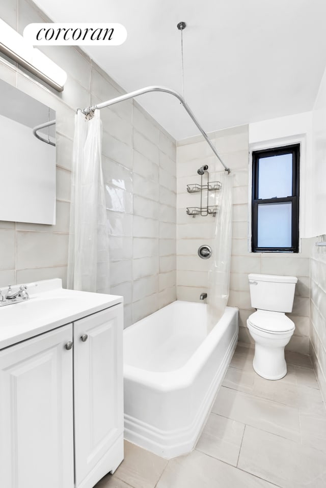 bathroom featuring tile walls, tile patterned flooring, shower / tub combo, vanity, and toilet