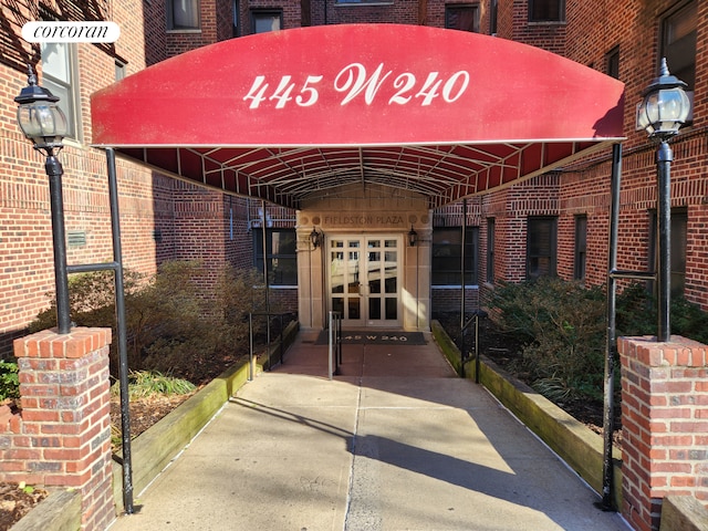 property entrance with brick siding