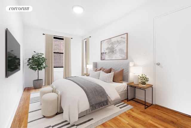 bedroom featuring wood finished floors