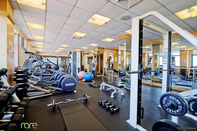 340 E 93rd St Unit 28D, New York City, NY 10128 - exercise room with visible vents, a paneled ceiling, and a wealth of natural light