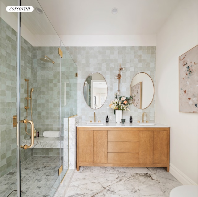 313 Troy Ave, New York City, NY 11213 - full bathroom with double vanity, a stall shower, marble finish floors, toilet, and baseboards