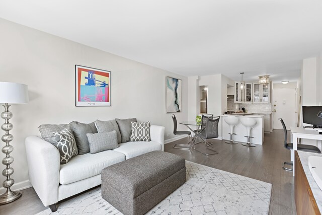 living room featuring baseboards and wood finished floors