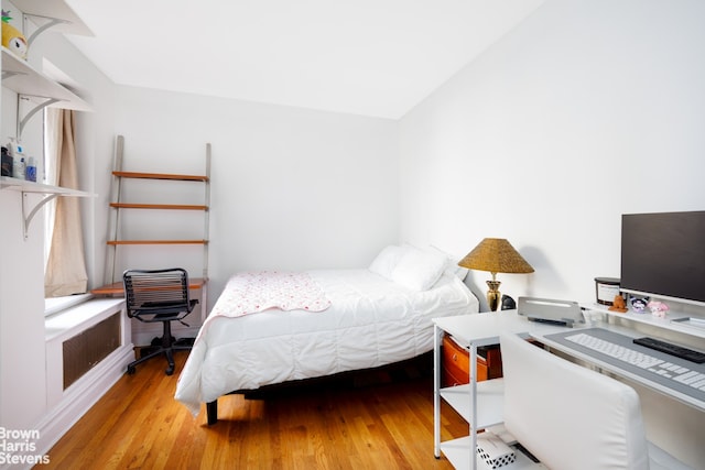 bedroom with wood finished floors