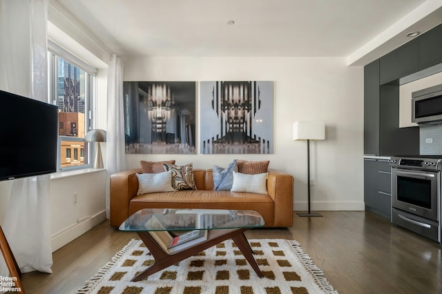 432 W 52nd St Unit 7H, New York City, NY 10019 - living area featuring wood finished floors and baseboards