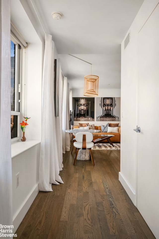 432 W 52nd St Unit 7H, New York City, NY 10019 - hall featuring dark wood finished floors