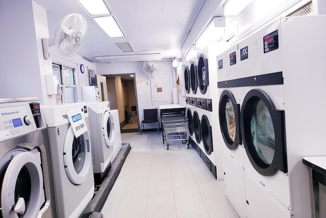 common laundry area featuring washing machine and clothes dryer and stacked washing maching and dryer