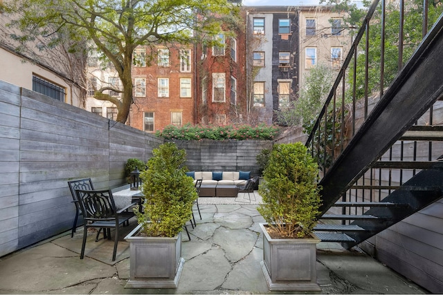 428 W 23rd St Unit 1A, New York City, NY 10011 - view of patio / terrace with stairway and fence