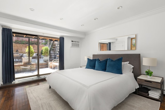 428 W 23rd St Unit 1A, New York City, NY 10011 - bedroom featuring access to outside, an AC wall unit, dark wood finished floors, recessed lighting, and ornamental molding