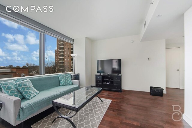 108-20 71st Ave Unit 4C, New York City, NY 11375 - living area with baseboards and wood finished floors