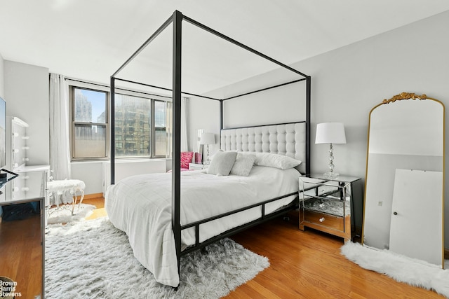 bedroom featuring wood finished floors