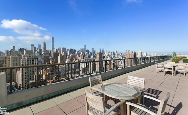 301 E 79th St Unit 21P, New York City, NY 10075 - view of patio / terrace with outdoor dining space and a view of skyline