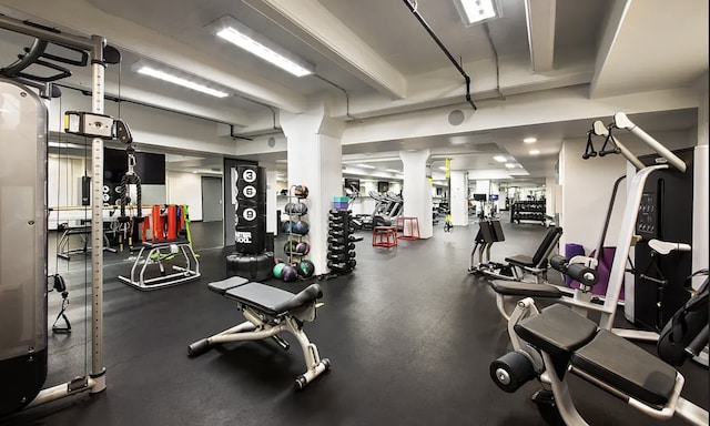 exercise room with ornate columns